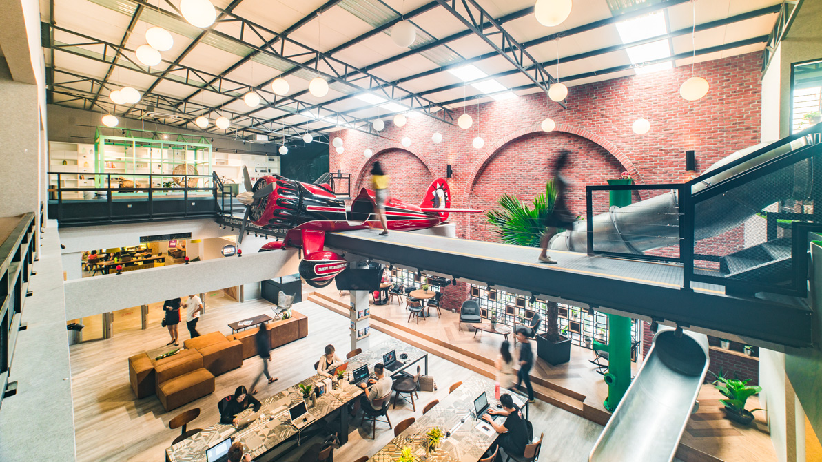 A bright red plane in the middle of the office to usher the members TO FLY